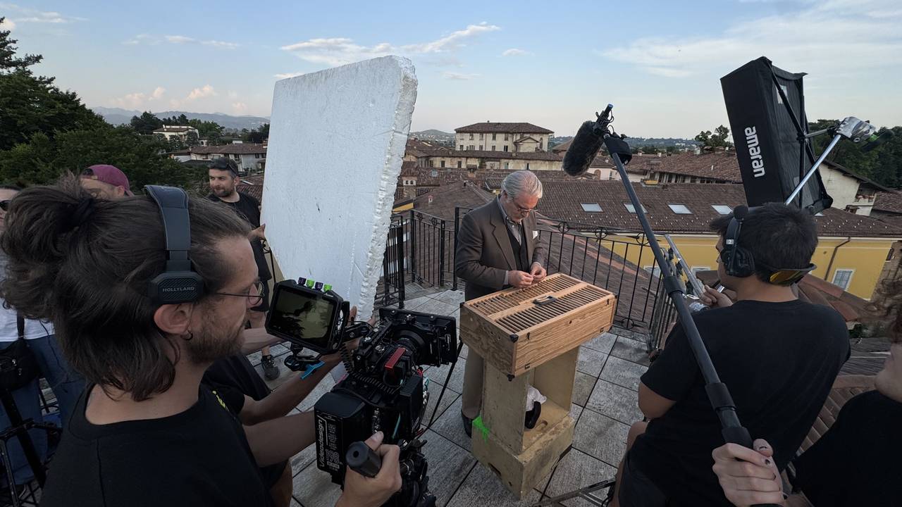 The full crew working a rooftop setup at golden hour